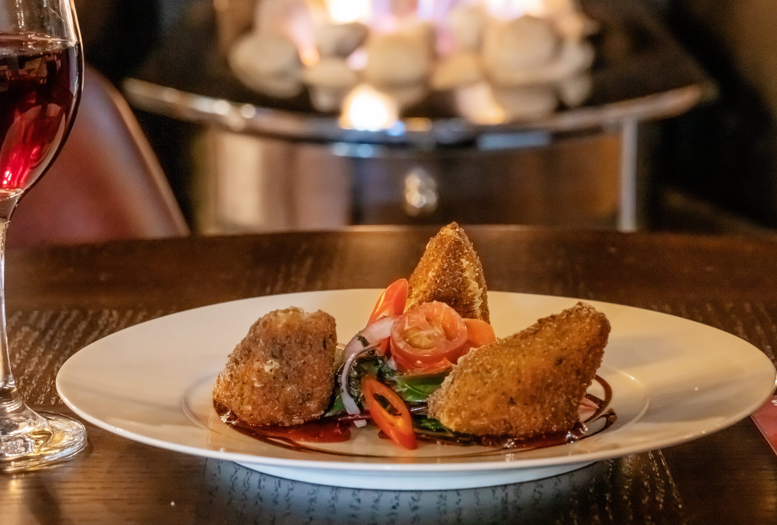Breaded Wicklow Brie wedges with sweet chilli jam by the fireside
